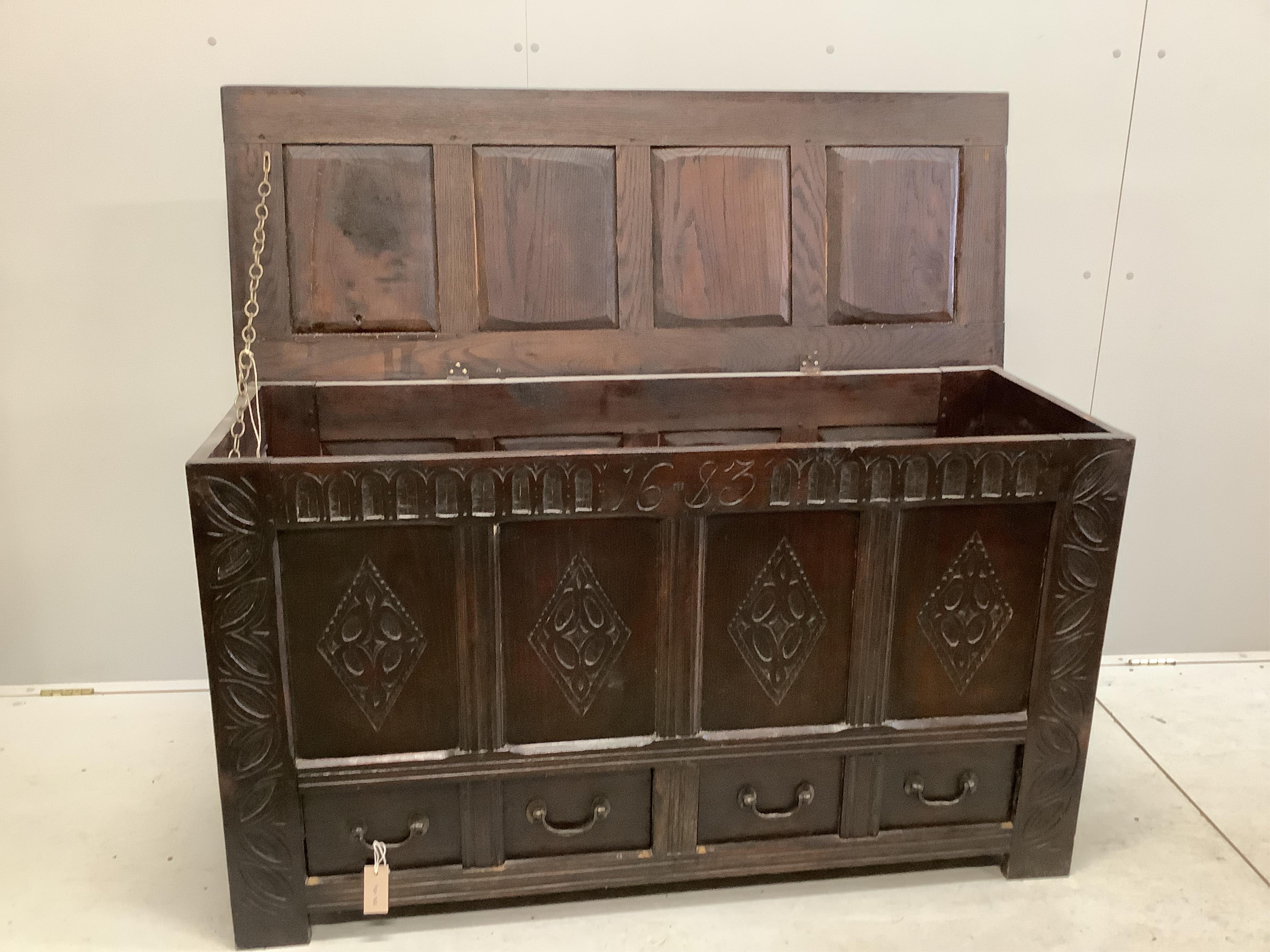 A carved oak mule chest bearing date 1683, width 139cm, depth 51cm, height 79cm. Condition - fair to good